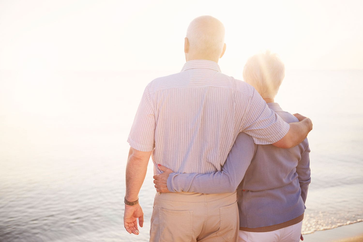 Featured image for Veteran Spouse Benefits, showing a Veteran and his spouse standing arm by arm