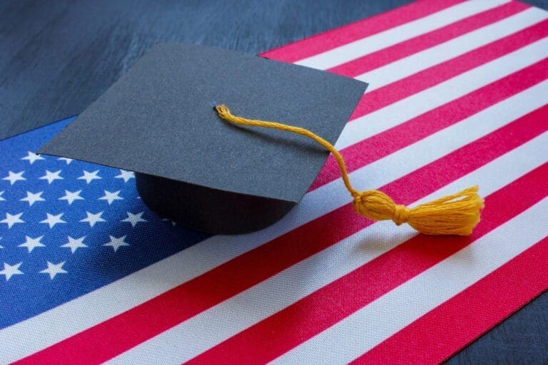 Featured image for Chapter 35 VA Benefits, showing a flag of the United States and an academic cap